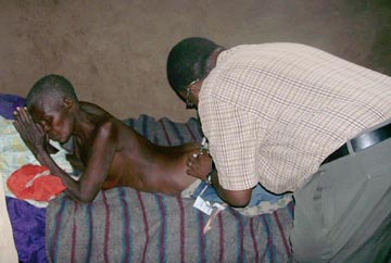 Dr. Moses giving medical assistance to the poorest of the poor