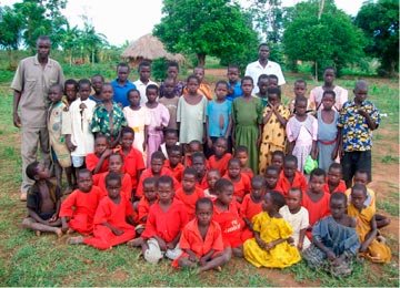 John Olupot with orphans he looks after